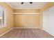 Spacious bedroom with ceiling fan, window shutters, and neutral carpeting at 2927 W Plum Hollow Dr, Anthem, AZ 85086