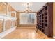 Elegant dining room with hardwood floors, chandelier, and built-in shelving at 2927 W Plum Hollow Dr, Anthem, AZ 85086