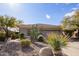 Single-story home with desert landscaping and two-car garage at 2927 W Plum Hollow Dr, Anthem, AZ 85086