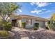 Single-story home with desert landscaping and two-car garage at 2927 W Plum Hollow Dr, Anthem, AZ 85086