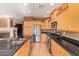 Kitchen features stainless steel appliances and granite counters at 2927 W Plum Hollow Dr, Anthem, AZ 85086