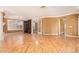 Living room with hardwood floors, tile, and built-in shelving at 2927 W Plum Hollow Dr, Anthem, AZ 85086