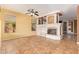 Bright living room featuring a fireplace and built-in shelving at 2927 W Plum Hollow Dr, Anthem, AZ 85086