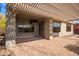Covered patio with brick pavers, pergola, and outdoor TV at 2927 W Plum Hollow Dr, Anthem, AZ 85086