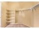 Spacious walk-in closet with shelves and hanging rods at 2927 W Plum Hollow Dr, Anthem, AZ 85086