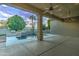 Covered patio and a pool with a waterfall feature, perfect for outdoor entertaining and relaxation at 300 N Portland Ave, Gilbert, AZ 85234