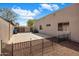 Backyard features gravel ground cover, privacy wall and metal fence at 300 N Portland Ave, Gilbert, AZ 85234