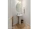 Powder room featuring a pedestal sink and oval mirror at 300 N Portland Ave, Gilbert, AZ 85234