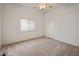 Neutral bedroom featuring plush carpet, a window, and ample space at 300 N Portland Ave, Gilbert, AZ 85234