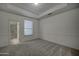 Bright bedroom with neutral carpet, and a view to an en-suite bathroom at 300 N Portland Ave, Gilbert, AZ 85234