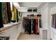 Spacious walk-in closet with an abundance of storage space, shelving, and hanging racks at 300 N Portland Ave, Gilbert, AZ 85234