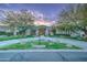 Beautiful home with mature trees, green lawn, and circular driveway at 300 N Portland Ave, Gilbert, AZ 85234