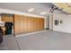 The garage offers ample storage cabinets and epoxy flooring at 300 N Portland Ave, Gilbert, AZ 85234