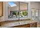 Kitchen window above sink offering views of the backyard and pool at 300 N Portland Ave, Gilbert, AZ 85234