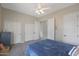 Bedroom with blue bedding and double doors at 3007 S Colonial St, Gilbert, AZ 85295