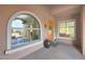 Inviting entryway with arched window and wooden door at 3007 S Colonial St, Gilbert, AZ 85295