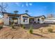 A sprawling backyard showcases the home's elegant exterior and ample space for outdoor activities at 3021 N 47Th St, Phoenix, AZ 85018