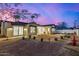 A dusk shot of the backyard with a newly landscaped yard at 3021 N 47Th St, Phoenix, AZ 85018