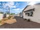 View of the newly renovated home backyard featuring modern design and minimalist desert landscaping at 3021 N 47Th St, Phoenix, AZ 85018