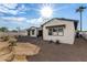 View of the newly renovated home backyard featuring modern design and minimalist desert landscaping at 3021 N 47Th St, Phoenix, AZ 85018