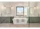 This is a large bathroom featuring a soaking tub, dual sinks, and hardwood floors, providing a spa-like experience at 3021 N 47Th St, Phoenix, AZ 85018