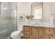 Charming bathroom featuring a tiled shower, vanity, and decorative accents, providing a functional and stylish space at 3021 N 47Th St, Phoenix, AZ 85018