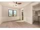 A bedroom featuring light hardwood floors and a large window at 3021 N 47Th St, Phoenix, AZ 85018