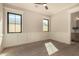 Empty bedroom with hardwood floors, wainscoting and a view to an adjacent bathroom at 3021 N 47Th St, Phoenix, AZ 85018