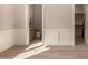 A bedroom featuring light hardwood floors and a view to the bathroom at 3021 N 47Th St, Phoenix, AZ 85018