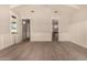Bright, spacious bedroom with hardwood floors, white walls and an ensuite bath at 3021 N 47Th St, Phoenix, AZ 85018