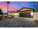 Striking single-Gathering home with a spacious driveway, modern garage door, and well-maintained landscaping at 3021 N 47Th St, Phoenix, AZ 85018