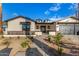 Beautiful single-Gathering home with inviting walkway, desert landscaping, and a modern black garage door at 3021 N 47Th St, Phoenix, AZ 85018