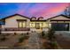 Beautiful single-Gathering home exterior with inviting walkway, mature landscaping, and a modern garage door at 3021 N 47Th St, Phoenix, AZ 85018