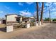 Attractive single-Gathering home with desert landscaping and a modern black garage door under a clear blue sky at 3021 N 47Th St, Phoenix, AZ 85018