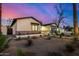 Inviting single-Gathering home exterior with modern design, brick accents, and desert landscaping in a dusk setting at 3021 N 47Th St, Phoenix, AZ 85018