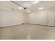 Spacious garage with epoxy flooring and ample lighting, perfect for parking and storage at 3021 N 47Th St, Phoenix, AZ 85018