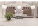 A spacious kitchen with stainless steel appliances and a white marble countertop island at 3021 N 47Th St, Phoenix, AZ 85018