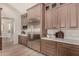 Gourmet kitchen with stainless steel appliances, ample counter space, and custom cabinetry at 3021 N 47Th St, Phoenix, AZ 85018