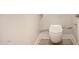 Modern white toilet with white marble backsplash and grey floors at 3021 N 47Th St, Phoenix, AZ 85018