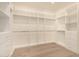 Spacious walk-in closet with custom shelving, providing ample storage and organization for clothing and accessories at 3021 N 47Th St, Phoenix, AZ 85018