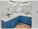 Bathroom with double vanity and blue cabinets at 30293 W Mitchell Ave, Buckeye, AZ 85396