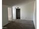 Bedroom with gray carpeting and a door to a closet at 3120 N 67Th Ln # 42, Phoenix, AZ 85033