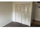 Bedroom with a large closet featuring louvered bi-fold doors at 3120 N 67Th Ln # 42, Phoenix, AZ 85033