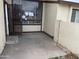 Apartment entryway with security door and small patio at 3120 N 67Th Ln # 42, Phoenix, AZ 85033