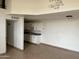 Kitchen with white cabinets, dark countertops, and an electric stove at 3120 N 67Th Ln # 42, Phoenix, AZ 85033