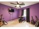 Fun, purple bedroom with guitar and black-out curtains for music creation at 37116 W Amberwood --, Tonopah, AZ 85354