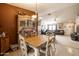 Dining area with tile floors, a hutch, and an adjacent living room at 37116 W Amberwood --, Tonopah, AZ 85354