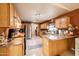 Bright kitchen with stainless steel refrigerator and tile flooring at 37116 W Amberwood --, Tonopah, AZ 85354