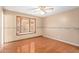 Bright bedroom with wood floors and bay window at 3837 W Port Au Prince Ln, Phoenix, AZ 85053