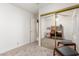 Bedroom featuring a mirrored closet and a workspace at 4044 W Whispering Wind Dr, Glendale, AZ 85310